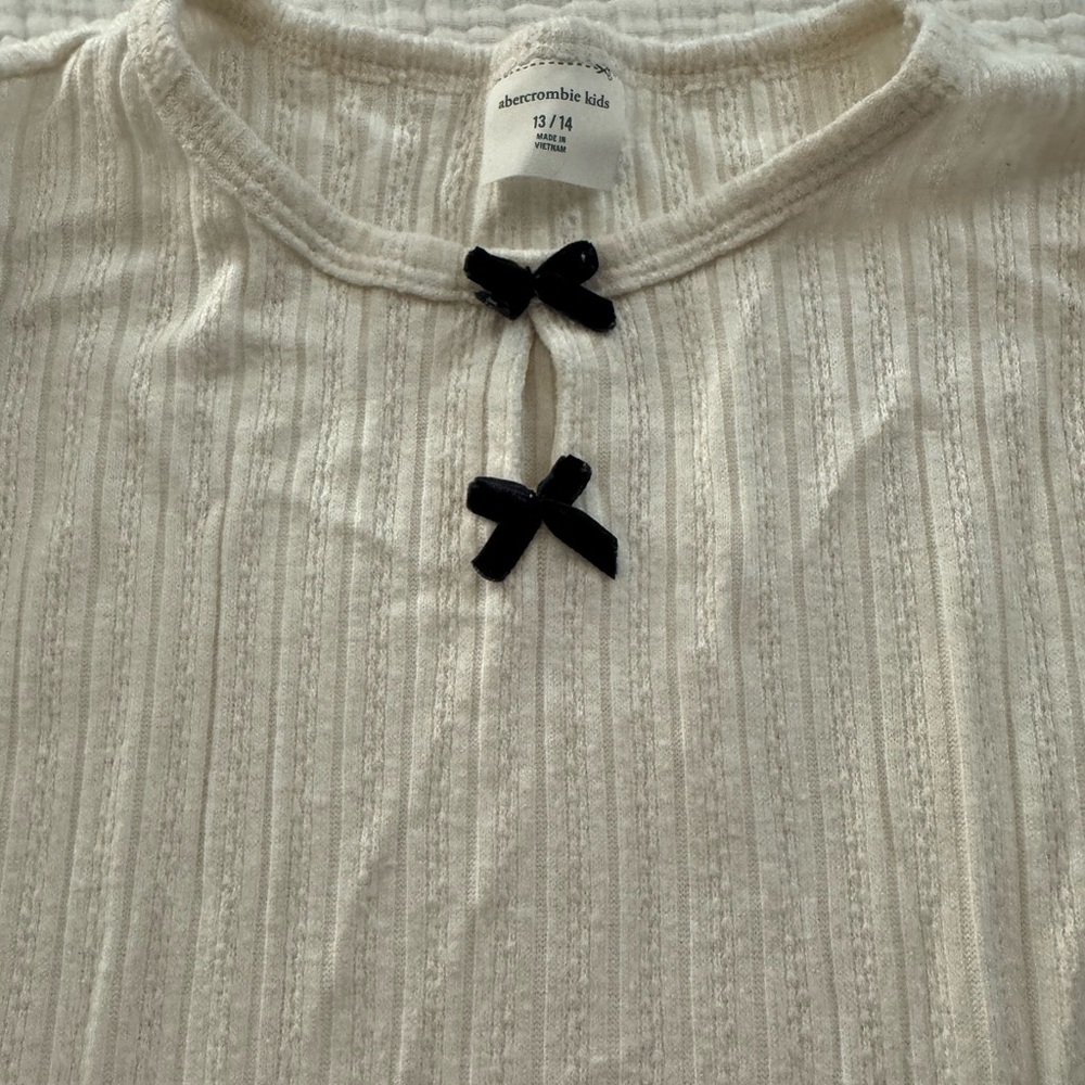 Abercrombie Kids Ivory light sweater like material Top with black Bows